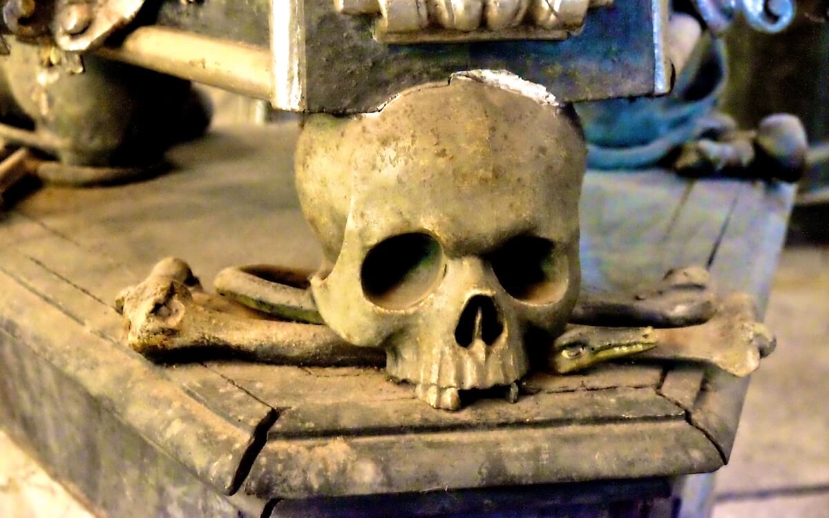 Fixture of skull at base of statue in the Sedlec Ossuary in Kutna Hora